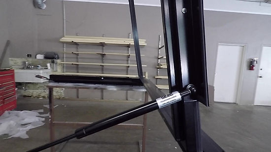 GAS SHOCKS ARE CONCEALED ON A FLIP OUT WINDOW